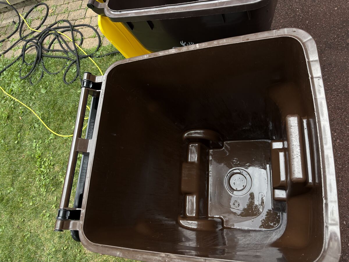 Clean trash bin interior after Bin Blasters power washing