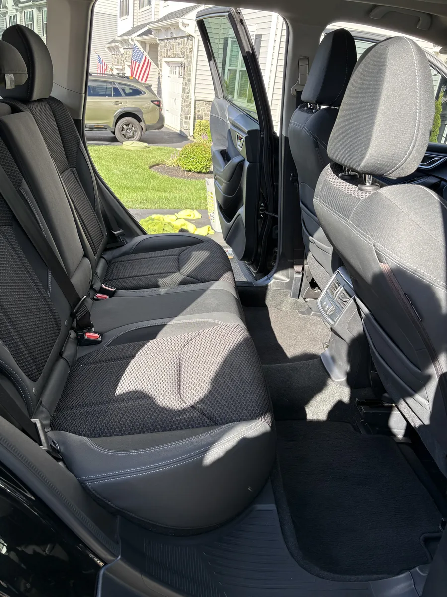 Clean rear-seat car interior after detailing